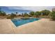 Backyard pool with water features, mature trees, and an inviting concrete deck perfect for outdoor entertaining at 8032 Audubon Canyon St, Las Vegas, NV 89131