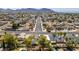 An aerial view of a neighborhood with mature landscaping and mountains in the background on a sunny day at 813 Cherry Dr, Henderson, NV 89002
