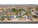 Aerial view of a residential area with similar houses, streets, and desert landscape at 813 Cherry Dr, Henderson, NV 89002