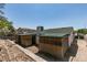 View of the backyard featuring an extension to the home with decorative exterior elements at 813 Cherry Dr, Henderson, NV 89002