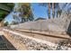 A backyard featuring a cinder block wall, planter and extension to the home at 813 Cherry Dr, Henderson, NV 89002
