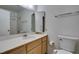 Bathroom featuring a large mirror over vanity, toilet, and shower at 813 Cherry Dr, Henderson, NV 89002