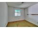 A sunny bedroom, with natural light, tan carpet and white walls at 813 Cherry Dr, Henderson, NV 89002