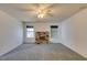 Living room with ceiling fan, fireplace, and carpeted flooring offers cozy comfort and charm at 813 Cherry Dr, Henderson, NV 89002