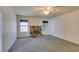 Spacious living room offers a fireplace, windows, and neutral carpet to add your personal touches at 813 Cherry Dr, Henderson, NV 89002