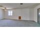 Neutral living room featuring neutral carpet, bright walls, and window light at 813 Cherry Dr, Henderson, NV 89002