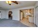Open living room offering views into the kitchen and featuring a decorative fireplace at 813 Cherry Dr, Henderson, NV 89002