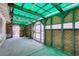 Open room with teal corrugated roof, neutral walls, concrete floor, and large opening at 813 Cherry Dr, Henderson, NV 89002
