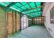 A bright room featuring a teal corrugated roof, neutral colored walls and an open entrance at 813 Cherry Dr, Henderson, NV 89002