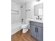 Modern bathroom offers bathtub, shower and vanity with marble countertops and updated hardware at 831 Purple Sage Ter, Henderson, NV 89015