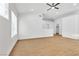Spacious living room with wood-look floors and lots of natural light at 831 Purple Sage Ter, Henderson, NV 89015