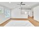 Open living area with wood-look flooring, recessed lighting, and a modern ceiling fan at 831 Purple Sage Ter, Henderson, NV 89015