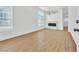 Bright living room features stylish light fixture, fireplace, and wood-look flooring at 831 Purple Sage Ter, Henderson, NV 89015