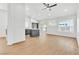 Modern living room boasts an open layout, wood-look flooring, and recessed lighting at 831 Purple Sage Ter, Henderson, NV 89015