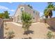 Minimalist backyard featuring low-maintenance landscaping, a block wall, and privacy from neighbors at 9011 Aldershot Ct, Las Vegas, NV 89147