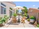 Outdoor dining space with large table and chairs, ideal for entertaining in the backyard at 9011 Aldershot Ct, Las Vegas, NV 89147