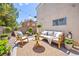 Cozy backyard lounge area with comfortable seating and ambient lighting, perfect for relaxing at 9011 Aldershot Ct, Las Vegas, NV 89147