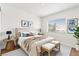 Bright bedroom featuring neutral tones, a comfortable bed, and modern décor at 9011 Aldershot Ct, Las Vegas, NV 89147