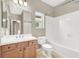 This bathroom features a single vanity, tile floors, and a shower-tub combo at 9225 Dalmahoy Pl, Las Vegas, NV 89145