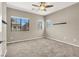 Comfortable bedroom with neutral walls, carpet floors, and multi-paned windows at 9225 Dalmahoy Pl, Las Vegas, NV 89145