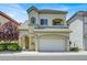 Charming two-story home with a well-maintained lawn and an attached two-car garage at 9225 Dalmahoy Pl, Las Vegas, NV 89145