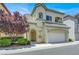Charming two-story home with a well-maintained lawn and an attached two-car garage at 9225 Dalmahoy Pl, Las Vegas, NV 89145