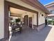 Outdoor patio with seating and community building with brick and stucco exterior at 9225 Dalmahoy Pl, Las Vegas, NV 89145