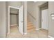 Inviting entryway featuring tile flooring and a staircase leading to the upper level at 9225 Dalmahoy Pl, Las Vegas, NV 89145