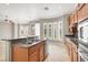 Spacious kitchen showcasing granite counters, stainless steel appliances and natural light at 9225 Dalmahoy Pl, Las Vegas, NV 89145