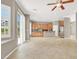 Open kitchen and dining area with stainless steel appliances and tile floors at 9225 Dalmahoy Pl, Las Vegas, NV 89145