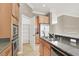Bright kitchen featuring granite countertops, stainless steel appliances, and ample cabinet space at 9225 Dalmahoy Pl, Las Vegas, NV 89145