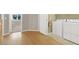 Bright laundry room with modern appliances and hardwood floors leading to the doorway at 9225 Dalmahoy Pl, Las Vegas, NV 89145