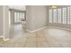 Open-concept living room with tile flooring, neutral walls, and ample natural light at 9225 Dalmahoy Pl, Las Vegas, NV 89145