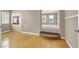 Comfortable living area featuring fireplace, hardwood floors, and access to another room at 9225 Dalmahoy Pl, Las Vegas, NV 89145
