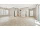 Open living room with tile flooring and neutral walls; ideal for versatile living at 9225 Dalmahoy Pl, Las Vegas, NV 89145