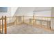 View of the upstairs loft featuring wood railings and plush carpeting at 9225 Dalmahoy Pl, Las Vegas, NV 89145