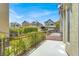 Outdoor patio with a view of the neighboring houses and well-maintained greenery at 9225 Dalmahoy Pl, Las Vegas, NV 89145