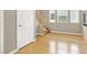 This foyer area showcases a staircase, wood floors and natural light at 9225 Dalmahoy Pl, Las Vegas, NV 89145