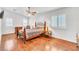Bright bedroom with a ceiling fan and hardwood floors at 930 High Plains Dr, Henderson, NV 89002