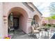 Charming front porch adorned with ample seating, offering a welcoming entry and street view at 930 High Plains Dr, Henderson, NV 89002