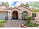 Charming home featuring a front porch with seating and meticulous landscaping at 930 High Plains Dr, Henderson, NV 89002