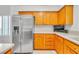 Modern kitchen featuring stainless steel refrigerator and ample counter space at 930 High Plains Dr, Henderson, NV 89002