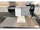 Kitchen featuring upgraded cabinets, granite countertops, and luxury vinyl plank flooring at 9546 Marsh Aster St, Las Vegas, NV 89139