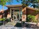 A community clubhouse featuring a well-manicured landscape and inviting glass entrance at 10231 Delray Beach Ave # 201, Las Vegas, NV 89129