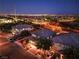 Night aerial view showing three houses with a beautiful city view at 10243 Aragon Crown Rd, Las Vegas, NV 89135
