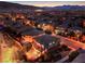 Night aerial view featuring homes, swimming pool, cozy backyard, and city lights at 10243 Aragon Crown Rd, Las Vegas, NV 89135