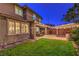 Spacious backyard featuring a lawn, covered patio, and an outdoor seating area perfect for entertaining at 10243 Aragon Crown Rd, Las Vegas, NV 89135