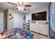 Bedroom featuring superhero themed decorations, ceiling fan and a large dresser with decor at 10243 Aragon Crown Rd, Las Vegas, NV 89135