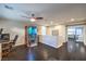 Spacious bonus room with dark wood floors, featuring a sauna, desk, and ceiling fan at 10243 Aragon Crown Rd, Las Vegas, NV 89135
