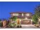 Charming two-story home with a well-maintained front yard and a two-car garage at 10243 Aragon Crown Rd, Las Vegas, NV 89135